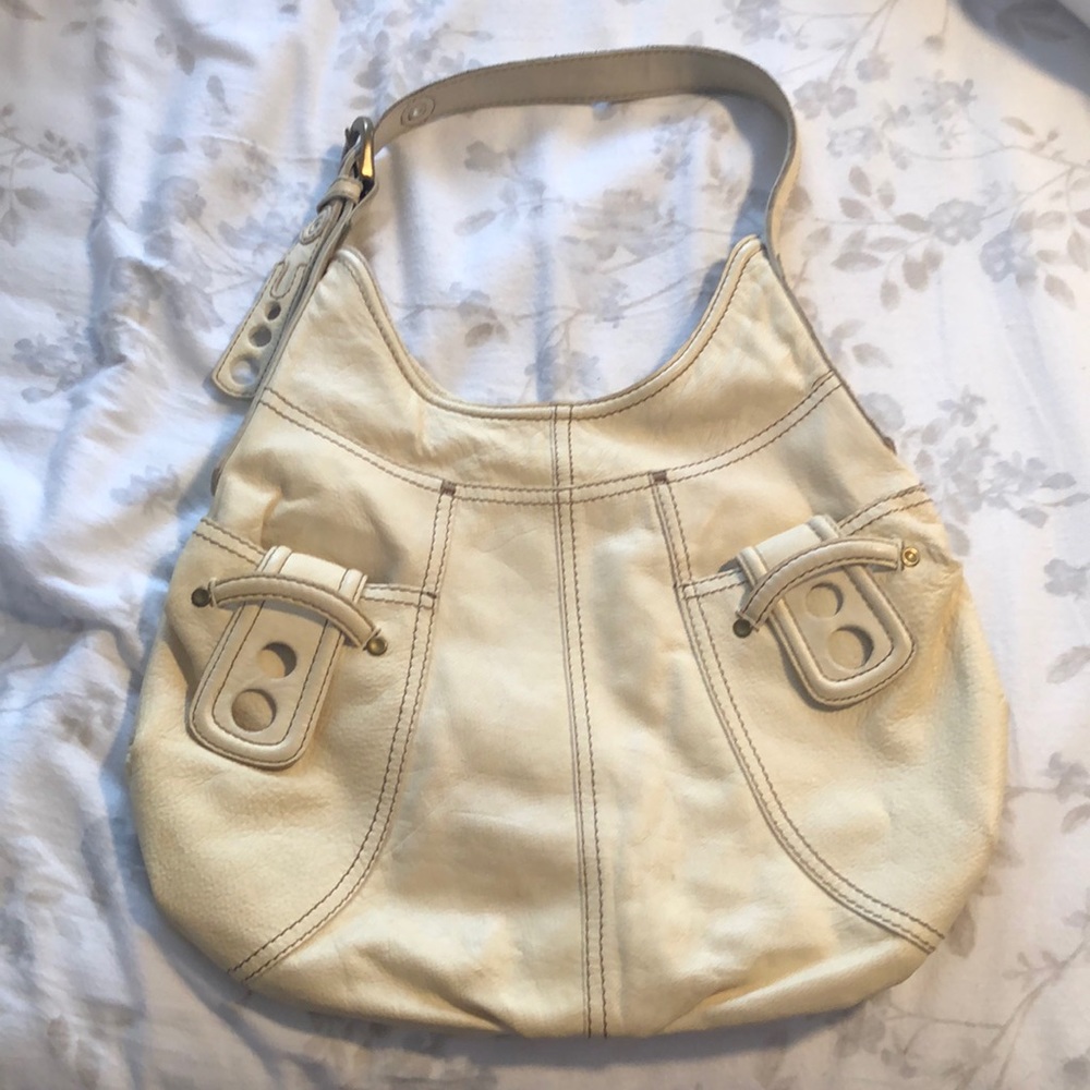 Creamy white Lucky Brand vintage inspired expert makers handbag.